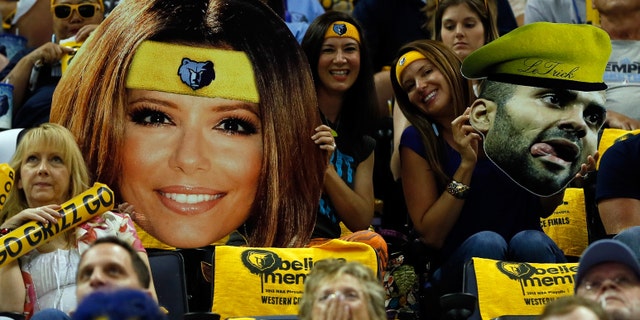 MEMPHIS, TN - MAY 25: Fans hold up cut-outs of actress Eva Longoria and Tony Parker #9 of the San Antonio Spurs in the first half during Game Three of the Western Conference Finals of the 2013 NBA Playoffs at the FedExForum on May 25, 2013 in Memphis, Tennessee. NOTE TO USER: User expressly acknowledges and agrees that, by downloading and or using this photograph, User is consenting to the terms and conditions of the Getty Images License Agreement. (Photo by Kevin C. Cox/Getty Images)