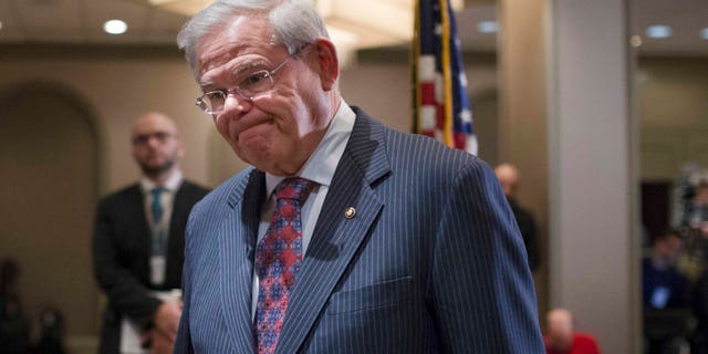Sen. Bob Menendez, D-N.J., leaves after news conference in Newark, N.J. on Friday, March 6, 2015.