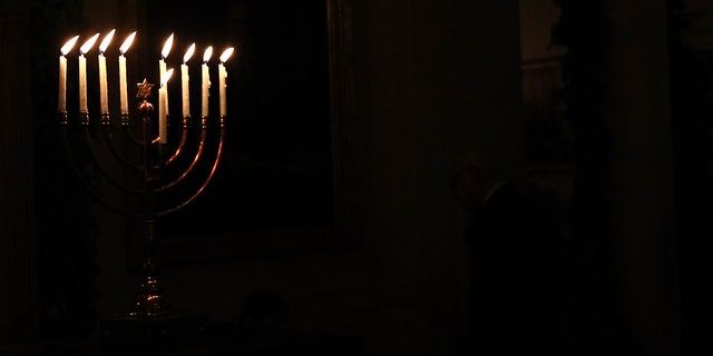 WASHINGTON, DC - DECEMBER 08:  (AFP OUT) A menorah burns in the White House after U.S. President Barack Obama delivered remarks during a Hanukkah reception December 8, 2011 in Washington, DC. The reception helped recognize and celebrate the Jewish tradition also known as the Festival of Lights.  (Photo by Win McNamee/Getty Images)