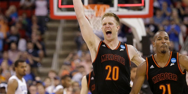 Mar. 21, 2014: Mercer forward Jakob Gollon (20) and guard Langston Hall (21) celebrate after defeating Duke 78-71 in an NCAA college basketball second-round game against Duke, in Raleigh, N.C.