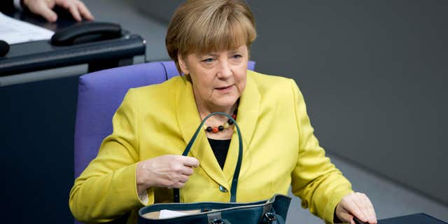 Feb. 27, 2015: German Chancellor Angela Merkel arrives for a debate at the German parliament, the Bundestag in Berlin.