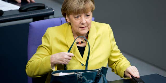 Feb. 27, 2015: German Chancellor Angela Merkel arrives for a debate at the German parliament, the Bundestag in Berlin.