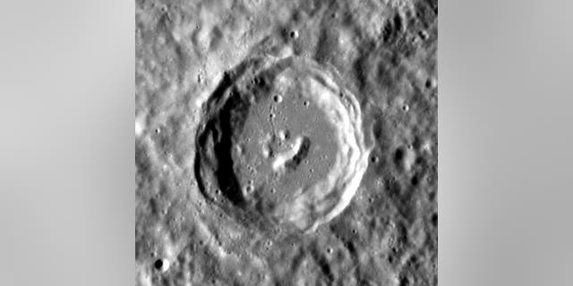 The central peaks of this complex crater on Mercury formed in such a way that it resembles a smiling face. This image was taken by NASA's Messenger spacecraft.