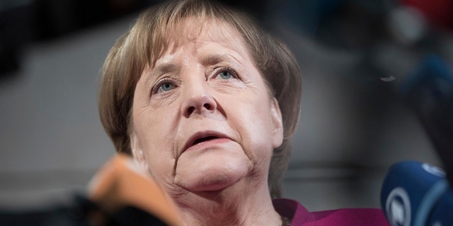 German chancellor Angela Merkel delivers a statement in Berlin, Sunday, Jan. 7, 2018.