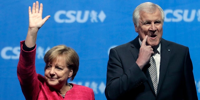 Angela Merkel and Horst Seehofer in happer times, at a September 2017 campaign rally.