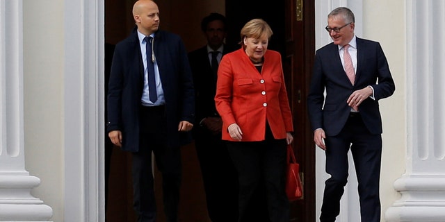 German Chancellor Angela Merkel leaves the meeting with President Frank-Walter Steinmeier after coalition government talks collapsed in Berlin, Germany, Nov. 20, 2017.