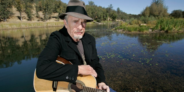 In this Oct. 2, 2007 file photo, Merle Haggard poses for a photo at his ranch at Palo Cedro, Calif. Haggard will be honored a year after his death with an all-star concert featuring his longtime friend and duet partner Willie Nelson as well as Kenny Chesney, Miranda Lambert and John Mellencamp. The country music star died of pneumonia on April 6, 2016, in Palo Cedro. He was 79.