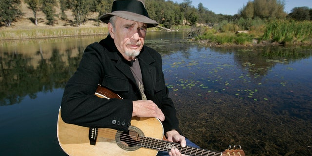 In this Oct. 2, 2007 file photo, Merle Haggard poses for a photo at his ranch at Palo Cedro, Calif. Haggard will be honored a year after his death with an all-star concert featuring his longtime friend and duet partner Willie Nelson as well as Kenny Chesney, Miranda Lambert and John Mellencamp. The country music star died of pneumonia on April 6, 2016, in Palo Cedro. He was 79.