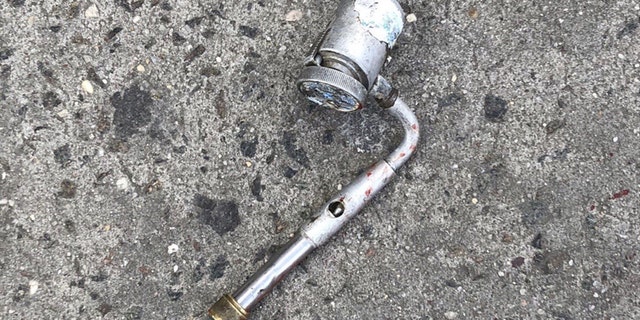The metal pipe Vassell was wielding. Police initially believed it was a firearm.