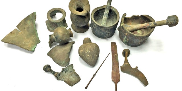 A toggle pin and head of a knife that are 3,500 years old. (Photographic credit: Diego Barkan, Israel Antiquities Authority).