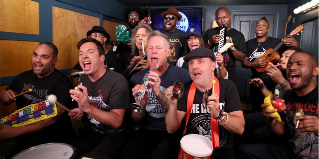 Pictured: (l-r) James Kamal Gray, host Jimmy Fallon, Frank Knuckles Walker, Ahmir "Questlove" Thompson, Kirk Hammett, James Hetfield, Tariq Black Thought Trotter, Robert Trujillo, Lars Ulrich, James Poyser, Kirk Captain Kirk Douglas, Mark Kelley, and Damon Tuba Gooding Jr. Bryson sing during the "Metallica Music Room" sketch on November 16, 2016.