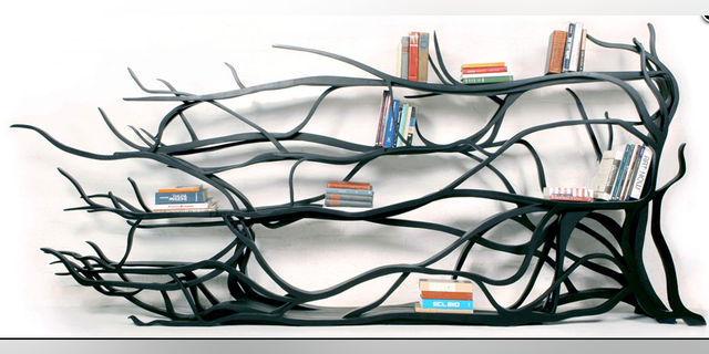 Meetsebastian.com%0AHand-carved%20bookshelf%20by%20artist%2C%20Sebastian%20Errazuriz.%0A