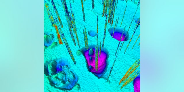 Giant craters along the floor of the Barents Sea were created when methane gases erupted about 11,600 years ago. Today, smaller seeps (vertical lines) still bubble up around the craters.