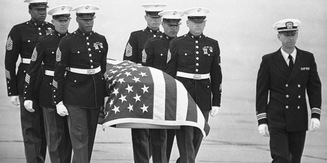FILE - In this March 8, 1985, file photo, U.S. Marine Corps pallbearers carry the casket holding the body of slain U.S. Drug Enforcement agent Enrique Camarena Salazar after it arrived at North Island Naval Air Station, in San Diego.