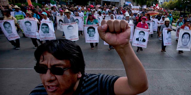 Relatives of the 43 missing students during a protest in Mexico City, Sunday, July 26, 2015.