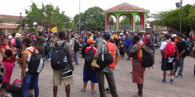 Central American migrants gather before continuing their journey to the U.S.