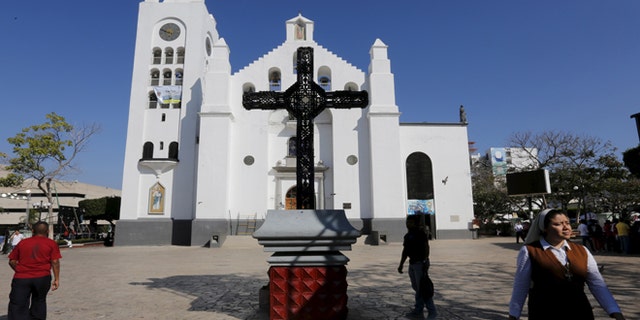 A Catholic nun walks outside the San Marco cathedral in Tuxtla Gutierrez, Chiapas, Mexico February 14, 2016.