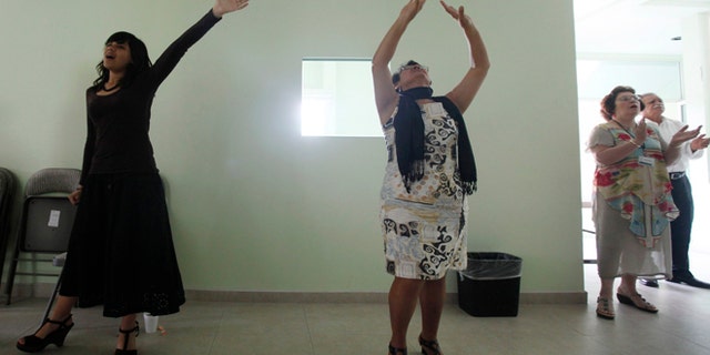 March 11, 2012: Worshippers attend a prayer in an evangelical church in Leon