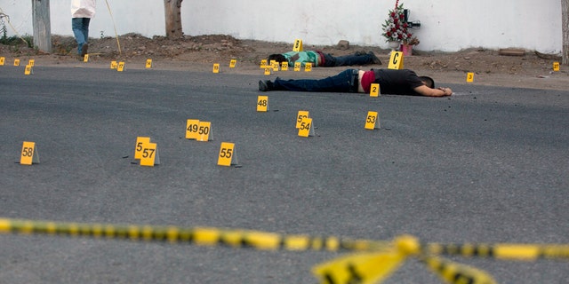 Bodies lie beside a road after a shooting in Mexico's Sinaloa state this past June.