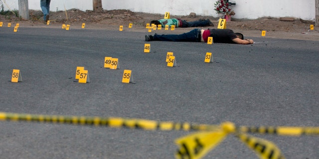 Bodies lie beside a road after a shooting in Mexico's Sinaloa state this past June.