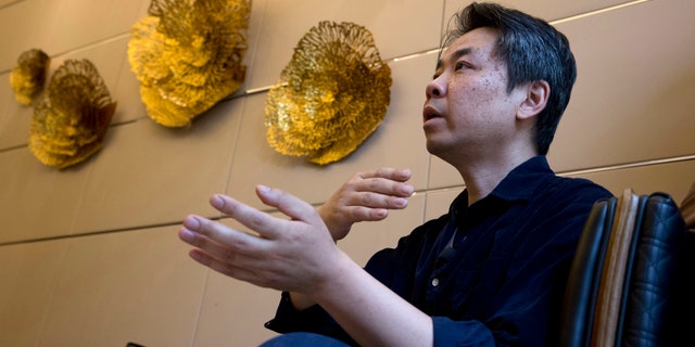 In this May 24, 2018, photo, Jiang Hui whose mother was on board the missing Malaysia airplane MH370 speaks to journalist about Texas-based company Ocean Infinity's search in Beijing, China. Australia said Tuesday that it was holding out hope that Malaysia Airlines Flight 370 would one day be found, as the last search by Ocean Infinity of the seabed in the remote Indian Ocean where the plane was believed to have been lost was scheduled to end Tuesday. (AP Photo/Ng Han Guan)