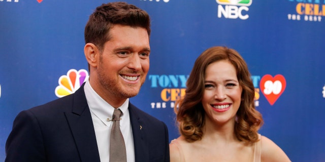 Singer Michael Buble (L) and Luisana Lopilato walk on the red carpet for "Tony Bennett Celebrates 90: The Best Is Yet to Come" at the legendary Radio City Music Hall in New York, U.S., September 15, 2016.