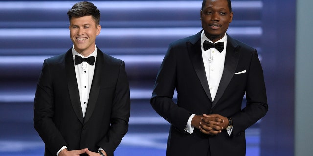 Co-hosts Colin Jost, left, and Michael Che, right, poked fun at Roseanne Barr during the Emmy Awards.