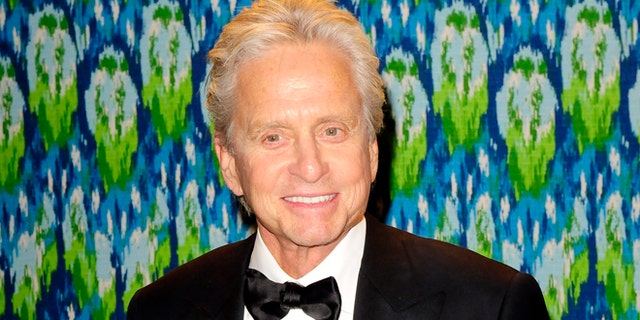 Winner of the Best Actor in a Mini-Series or TV Movie award Michael Douglas arrives at the 65th Primetime Emmy Awards HBO after-party in West Hollywood September 22, 2013. REUTERS/Gus Ruelas (UNITED STATES - Tags: ENTERTAINMENT) - RTX13WKH