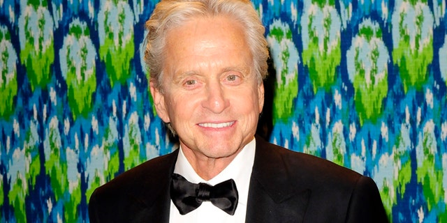 Winner of the Best Actor in a Mini-Series or TV Movie award Michael Douglas arrives at the 65th Primetime Emmy Awards HBO after-party in West Hollywood September 22, 2013. REUTERS/Gus Ruelas (UNITED STATES - Tags: ENTERTAINMENT) - RTX13WKH