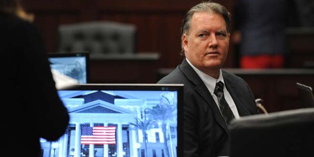 Sept. 27, 2014: Michael Dunn looks towards the legal representative sitting with his parents as his trial ends for the day in the Duval County Courthouse in Jacksonville, Fla.
