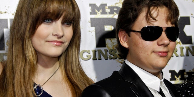 Paris and her brother Prince, children of the late Michael Jackson, arrive at the Mr. Pink Ginseng Drink launch party at the Beverly Wilshire Hotel in Beverly Hills, California, October 11, 2012.