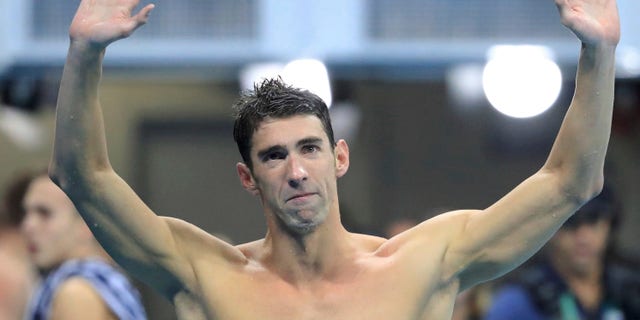 2016 Rio Olympics - Swimming - Final - Men's 4 x 100m Medley Relay Final - Olympic Aquatics Stadium - Rio de Janeiro, Brazil - 13/08/2016. Michael Phelps (USA) of USA reacts.