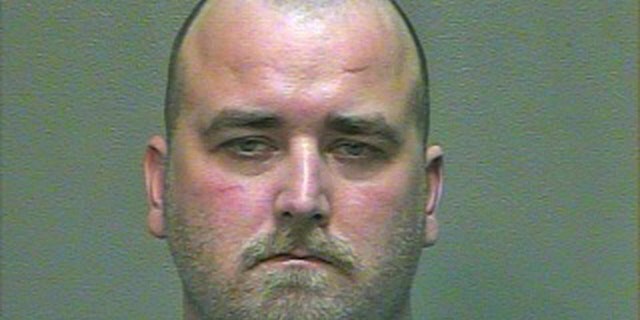 This 2014 booking photo provided by the Oklahoma County Sheriff's Office shows Michael Tate Reed. Reed, of Van Buren, Ark., was admitted to a hospital for mental treatment and formal charges were never filed after he allegedly drove his car into the Ten Commandments monument on the state Capitol grounds in 2014. On Wednesday, June 28, 2017, Reed was arrested for driving into and smashing the monument. (Oklahoma County Sheriff's Office via AP)