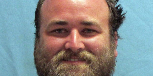 This photo provided by the Pulaski County Sheriff's Office in Little Rock, Ark., shows Michael Tate Reed, of Van Buren, Ark., who was booked into the jail Wednesday morning, June 28, 2017, on preliminary charges of defacing objects of public interest, criminal trespass and first-degree criminal mischief. He is accused driving a vehicle into Arkansas' new Ten Commandments monument on the state Capitol grounds in Little Rock. (Pulaski County Sheriff's Office via AP)
