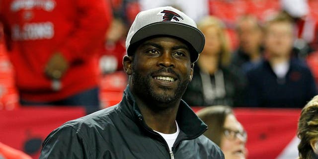 Former Atlanta Falcons quarterback Michael Vick stands on the sidelines before an NFL football game between the New Orleans Saints and the Atlanta Falcons at the Georgia Dome January 1, 2017 in Atlanta, GA.