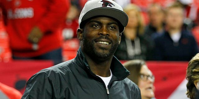 Former Atlanta Falcons quarterback Michael Vick stands on the sidelines before an NFL football game between the New Orleans Saints and the Atlanta Falcons at the Georgia Dome January 1, 2017 in Atlanta, GA.