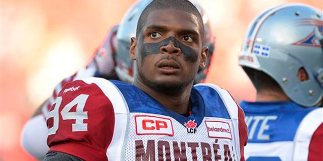 Aug. 7, 2014: In this file photo, Montreal Alouettes' Michael Sam and teammates warm up for a Canadian Football League game against the Ottawa Redblacks in Ottawa, Ontario.