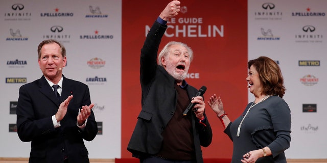 French chef Pierre Gagnaire reacts after earning an award at the 2018 Michelin ceremony.