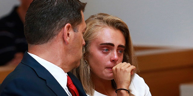 Michelle Carter awaits her sentencing in a courtroom in Taunton, Mass.