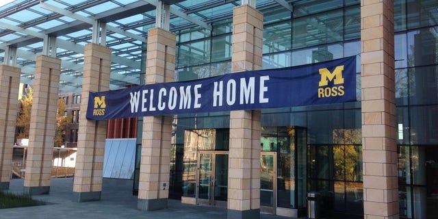 A sign welcomes visitors to the Stephen M. Ross School of Business on the University of Michigan campus in Ann Arbor, Mich., on Monday, Nov. 3, 2014. Crews working on a $135 million expansion of the Ross School moved a 65-foot-tall tree 500 feet from the side of the building to an area close to the front entrance. (AP Photo, Mike Householder)