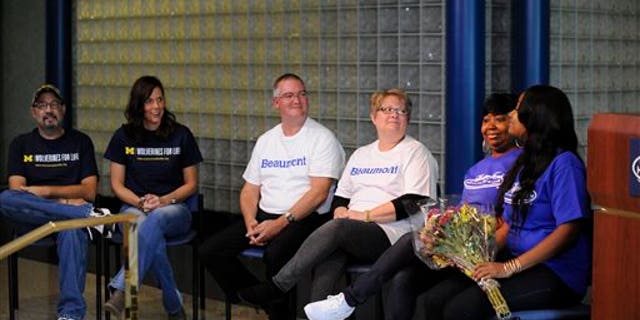From the left; David Hostetler, Tricia Meyer, Tom Ash, Lisa Ash, Kim Yarbrough and Markeshia Valentine meet for the first time in Detroit on Thursday, Oct. 22, 2015. (David Coates/The Detroit News via AP)