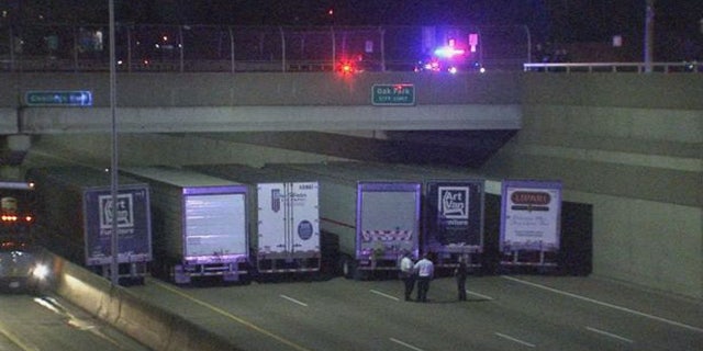 The trucks were parked under the bridge for several hours while police negotiated with the man.