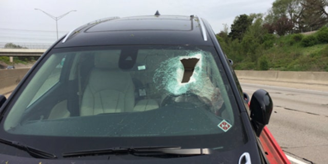 A woman was knocked unconscious Wednesday when a piece of concrete came off I-696 and crashed through her windshield.