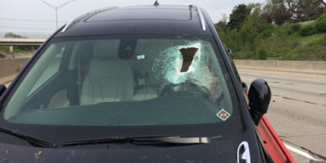 A woman was knocked unconscious Wednesday when a piece of concrete came off I-696 and crashed through her windshield.