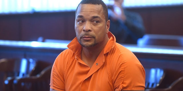 Gregory Green is arraigned in 20th District Court in Dearborn Heights, Mich., on Thursday Sept. 22, 2016. Green is suspected of killing two young children and two teenagers and critically injured his wife at his at his Detroit-area home. (Max Ortiz/The Detroit News via AP)