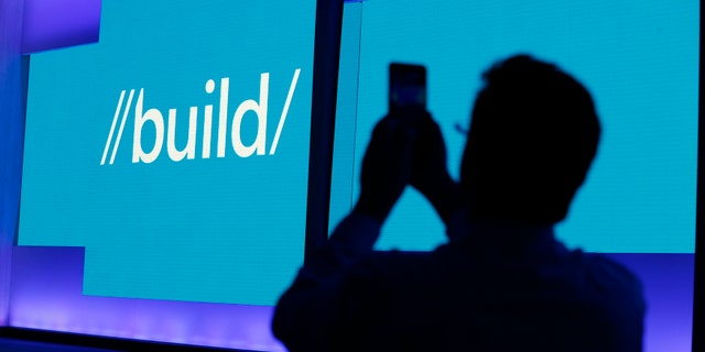 File photo - An attendee takes a picture before the keynote address during the Microsoft Build 2016 Developer Conference in San Francisco, Calif. March 30, 2016. (REUTERS/Beck Diefenbach)