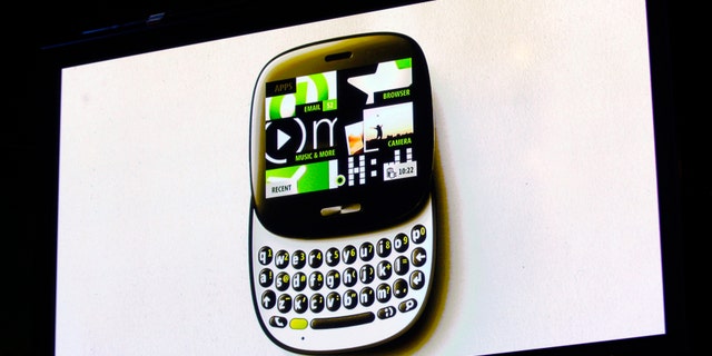 The image of the Kin One smartphone is projected on a screen at a Microsoft news conference in San Francisco, California April 12, 2010.