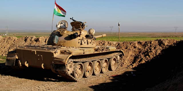 Jan. 20, 2015: Kurdish peshmerga forces prepare on the front line for battle against Islamic State group positions.