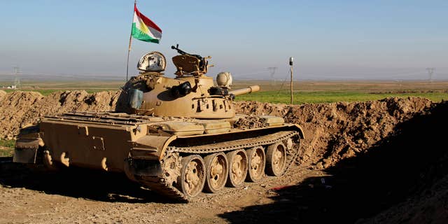 Jan. 20, 2015: Kurdish peshmerga forces prepare on the front line for battle against Islamic State group positions.