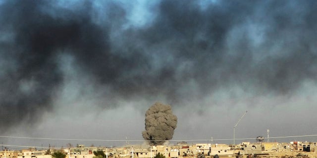 FILE: Dec. 25, 2015: Smoke from Islamic State positions following a U.S.-led coalition airstrike as Iraqi Security forces advance their position in downtown Ramadi, 70 miles west of Baghdad, Iraq. (AP)